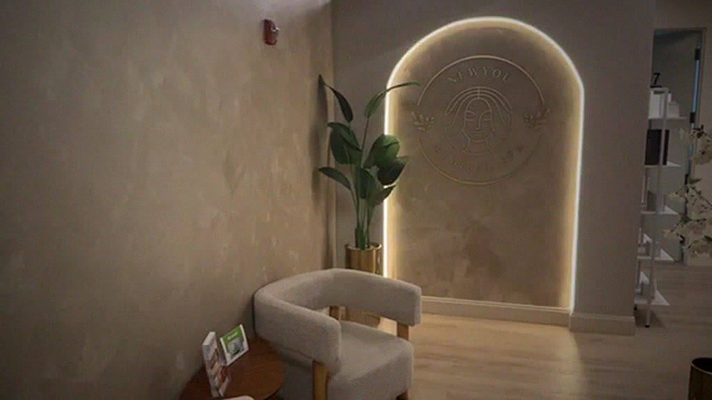 NewYou entrance with glowing arched logo wall